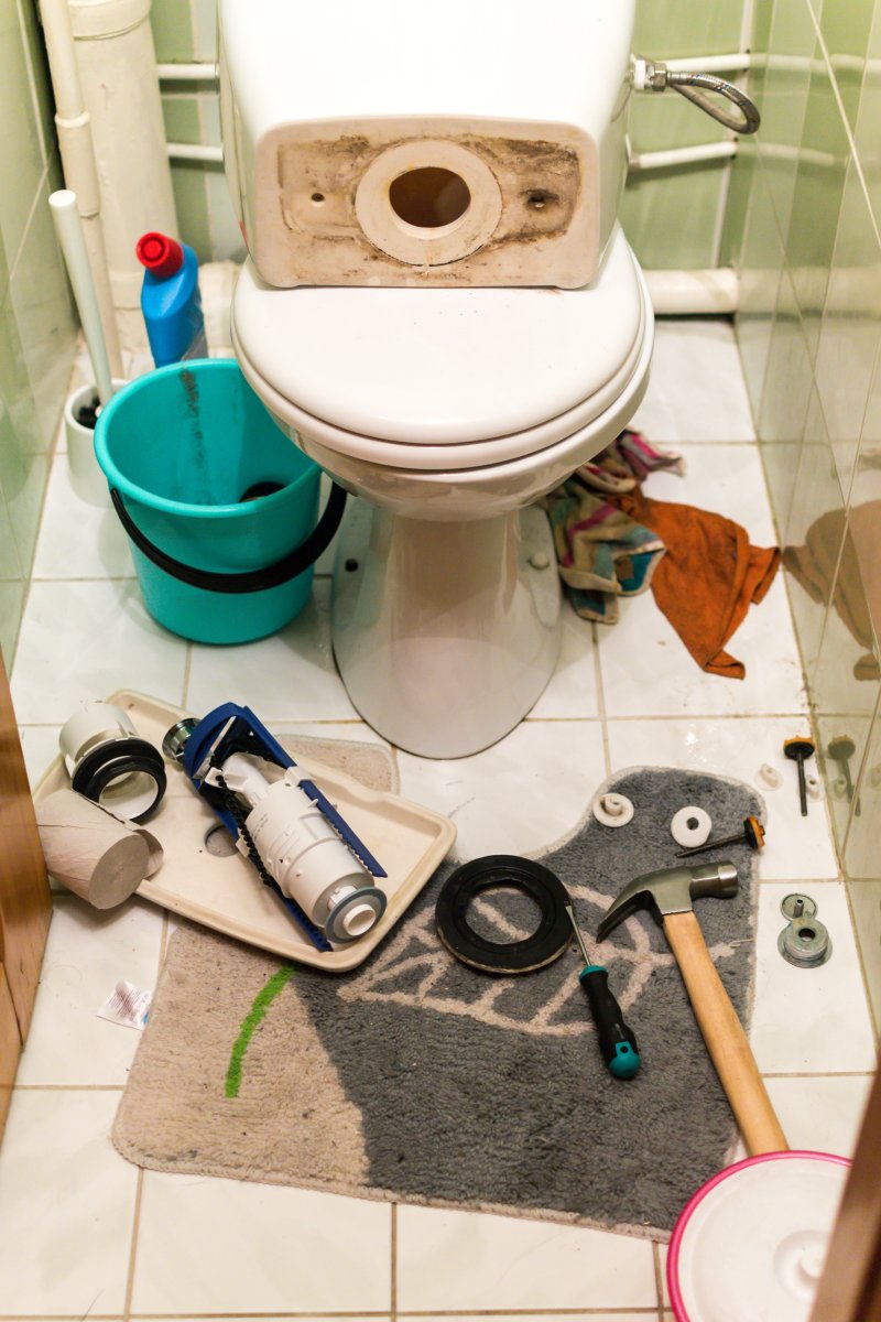 New toilet being installed in a Chiswick bathroom