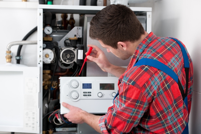 Gas Safe engineer working on a boiler in Chiswick